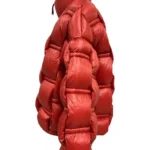 Chaqueta acolchada naranja Daniela de Dichi con cuello alto